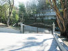 Looking down the private driveway through the gates
